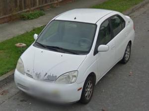 White Prius in street